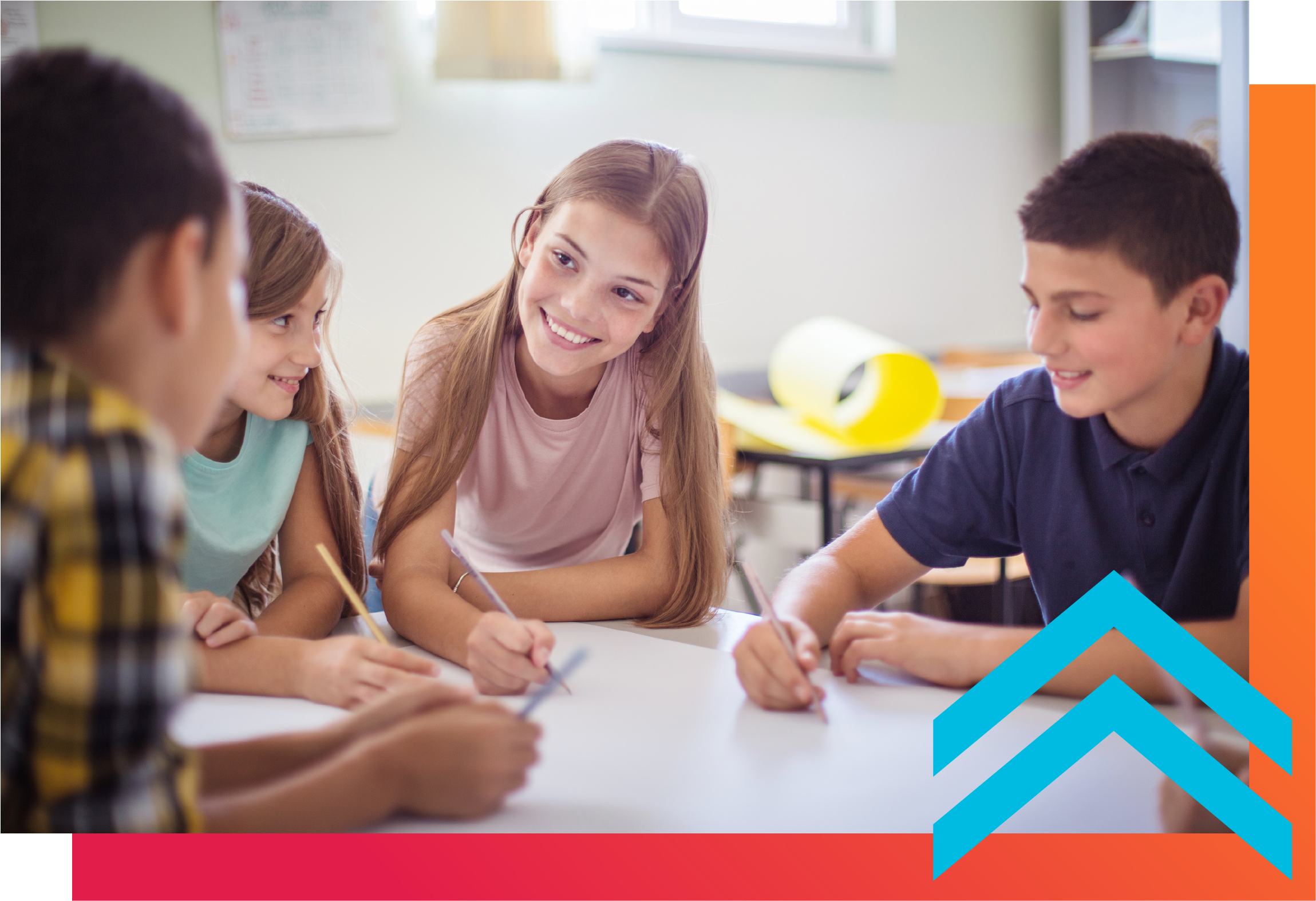 A group of middle school students are in a classroom working collaboratively
